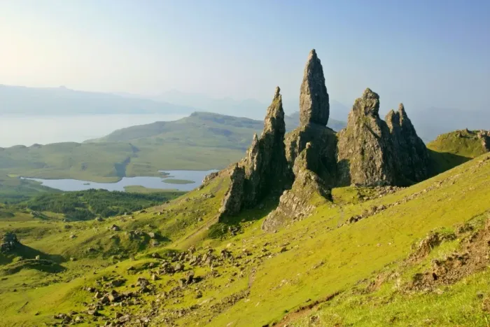Framed Print : Mountain scenery rolling green slopes and bizarre rock formation Old Man of Storr seen from above with view towards Sound of Raasay Isle of Skye, Western Highlands, Scotland, UK Framed Print : Mountain scenery rolling green slopes and bizarre rock formation Old Man of Storr seen from above with view towards Sound of Raasay Isle of Skye, Western Highlands, Scotland, UK