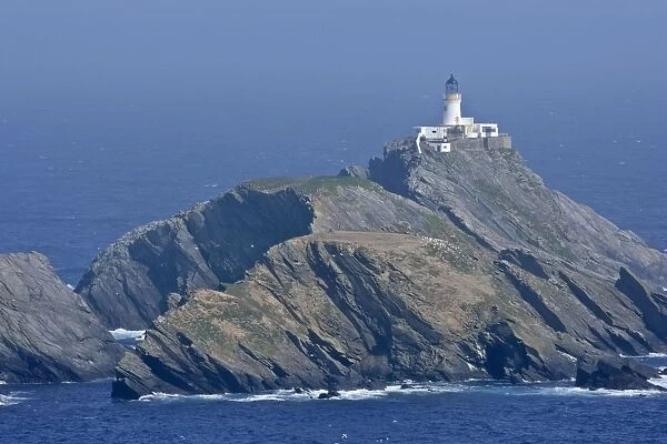 Muckle Flugga lighthouse most northerly lighthouse of Great Britain situated on offshore cliff seen from Hermaness Nature Reserve Unst, Shetland Isles, Scotland, UK