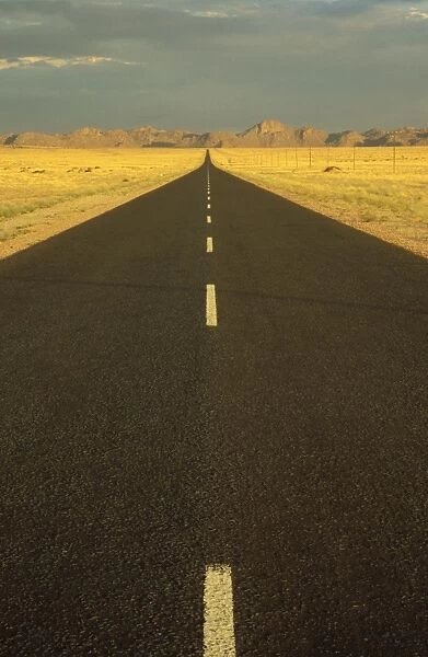 Namibia - The tarred road B 4, west of the village of Aus, in the evening. Namibia