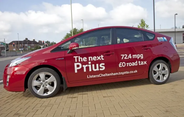 Framed Print : New Prius T3 hybrid red motor car fuel consumption - August 2009 parked outside Homebase in Cheltenham - Currently the world's most advanced hybrid car capable of more than 75 mpg Framed Print : New Prius T3 hybrid red motor car fuel consumption - August 2009 parked outside Homebase in Cheltenham - Currently the world's most advanced hybrid car capable of more than 75 mpg