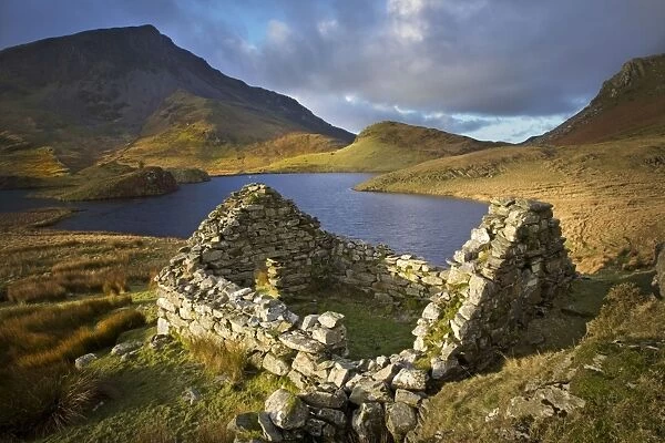 Old ruin over looking Llyn Dwyarchen in beautiful stormy light - North Wales - UK