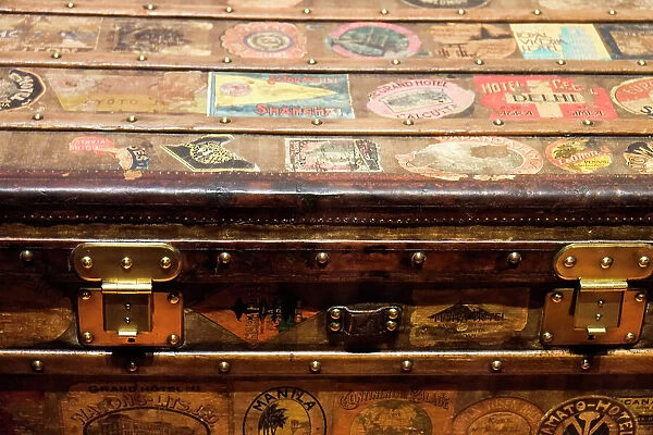 Old steamer trunk covered with stickers of various destinations. Date: 15-12-2017