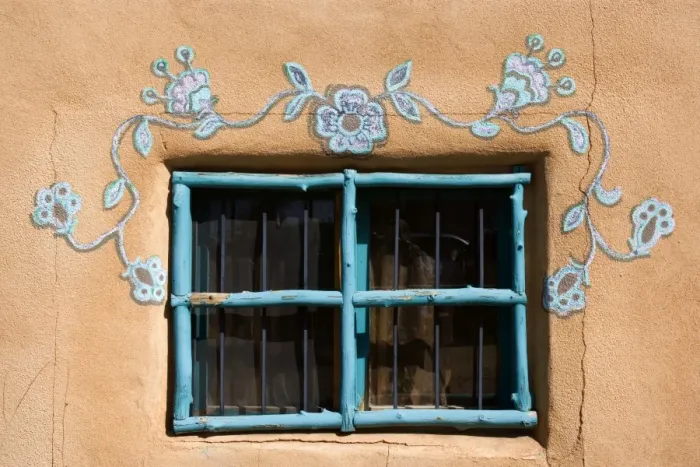 Framed Print : Ornate Window - turquoise painted window mounted in an adobe style building. It is decorated additionally by ornate paintings also in turqoise - Rancho de Taos, New Mexico, USA Framed Print : Ornate Window - turquoise painted window mounted in an adobe style building. It is decorated additionally by ornate paintings also in turqoise - Rancho de Taos, New Mexico, USA