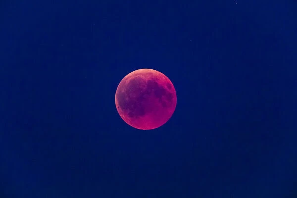 P2A1865. Moon Eclipse - the full moon appears red as it rises, during a full eclipse, 27th