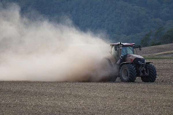 P2A3179. Farm Tractor - veiled in dust, sowing out seed after the drought in August