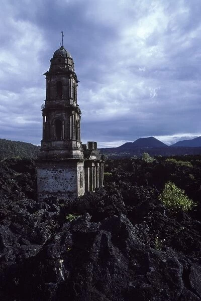 Paricutin volcano Mexico - State of Michoacan Paricutin volcano is the cone visible in the distance. The lava flows buried the village, only the church tower and part of the facade were left standing
