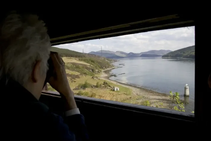 Framed Print : Person watching with binoculars in otter hide Kylerhea, Isle of Skye, Scotland Framed Print : Person watching with binoculars in otter hide Kylerhea, Isle of Skye, Scotland