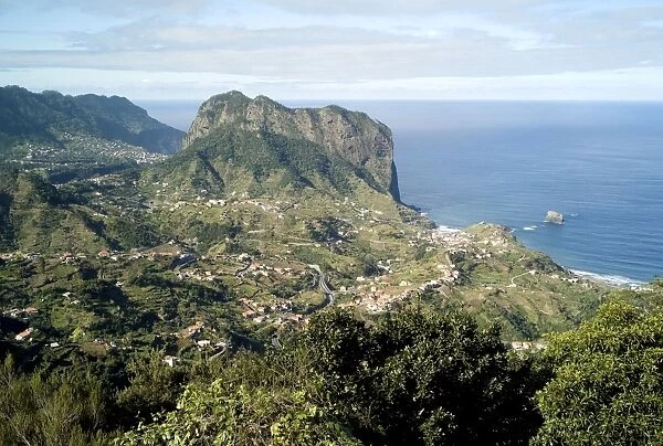 Porto da Cruz seen from Portela - Madeira. Beyond the town of Porto da Cruz lies the dominance of 'Eagle Rock' February