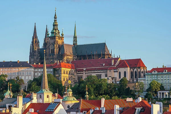 Prague, Czech Republic. St. Vitus Cathedral above roofs of city. Date: 02-07-2007