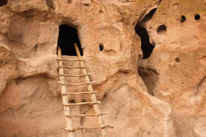 Framed Print : Pueblo Ruins - cave dwelling in Frijoles Canyon - wooden ladders lead into the cave by hand carved openings - these ruins were occupied for nearly 500 years until the late 1500s - Bandelier National Monument - Jemenez Mountains - New Mexico - USA Framed Print : Pueblo Ruins - cave dwelling in Frijoles Canyon - wooden ladders lead into the cave by hand carved openings - these ruins were occupied for nearly 500 years until the late 1500s - Bandelier National Monument - Jemenez Mountains - New Mexico - USA