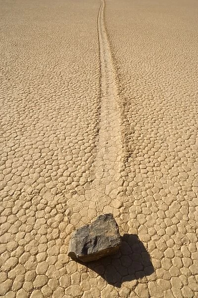 The Racetrack - mysterious sliding rocks of the famous Racetrack Playa - a dried up lake bed which is nestled between the Cottonwood Mountains and the Last Chance Range - furrows in the dried mud indicate that these boulders - some of them weighing
