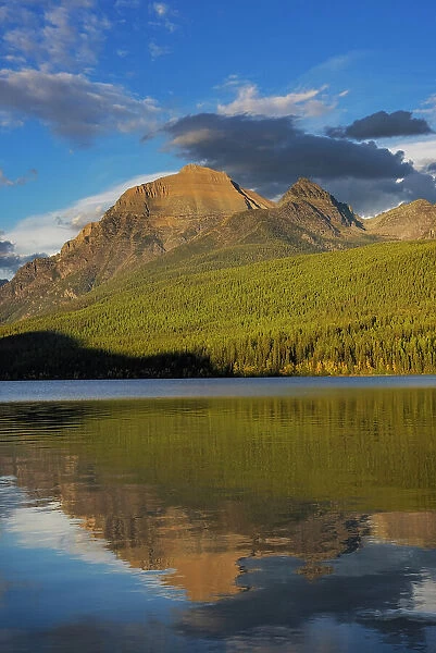 Rainbow Peak reflects in Bowman Lake in Glacier National Park, Montana, USA Date: 22-09-2021