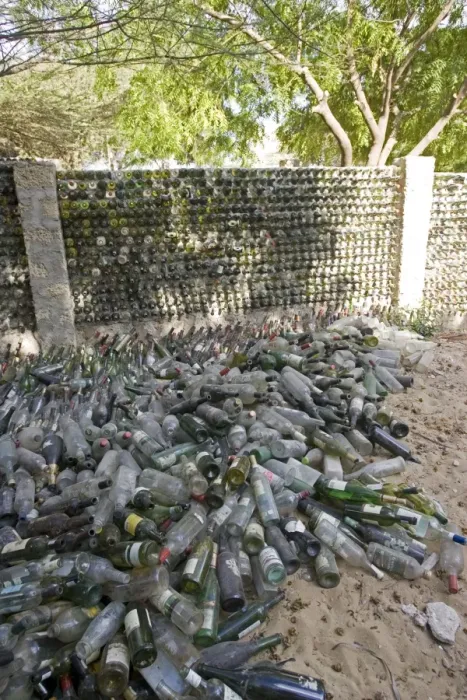 Framed Print : Recycling - wall built out of wine bottles. Lamu, Kenya Framed Print : Recycling - wall built out of wine bottles. Lamu, Kenya