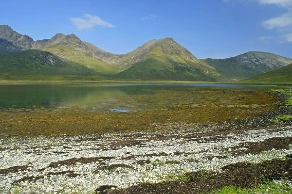 Red Cuillins and Loch Slapin seen from beach near Torrin at low tide Isle of Skye, Western Highlands, Scotland, UK