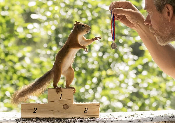 Red Squirrel and man with a medal