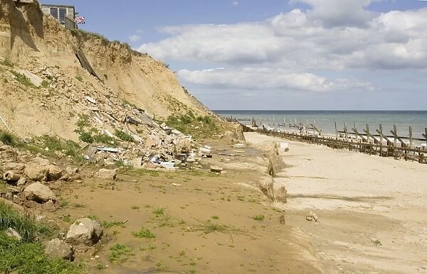 Remains of collapsed houses after severe coastal erosion Happisburgh North Norfolk Coast UK