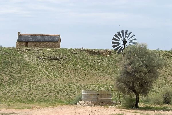Restored waterhole  /  watcher's farm house, built during World War 1. Waterholes with windmills established along Auob valley for military purposes; guarded and maintained by farmers in exchange for the right to farm the area