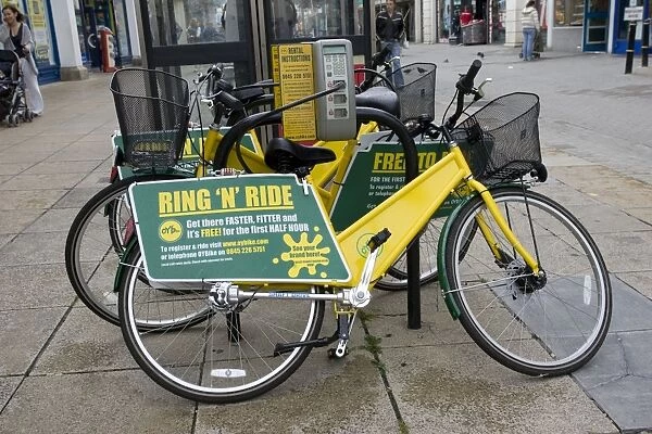 Ring N Ride OYB yellow bike rental docking station Cheltenham High Street Gloucestershire UK