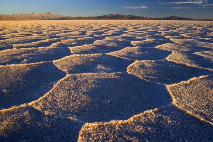 Framed Print : Salinas Grandes del Noroeste - mountains and dried-up salt lake showing a regular polygonal pattern created by salt crystals - at sunrise - the salinas are located on an altitude of 3450 m above sea level on the so-called Altiplano - Prov Framed Print : Salinas Grandes del Noroeste - mountains and dried-up salt lake showing a regular polygonal pattern created by salt crystals - at sunrise - the salinas are located on an altitude of 3450 m above sea level on the so-called Altiplano - Prov