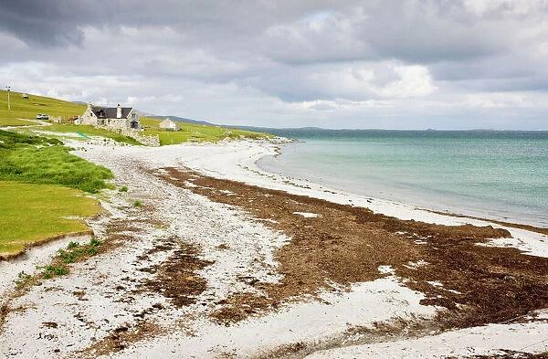 Sandy beach and croft on Berneray (Bearnaraigh), with the Sound of Harris beyond; Outer Hebrides, Scotland
