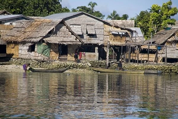 Shoreline houses at Busu village on Alite Island, Malaita, Solomon Islands. Presumably villages such as this one would have problems if sea levels rose due to global warming