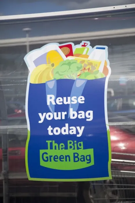 Framed Print : Sign encouraging use of reusable bags Tesco - Evesham - UK Framed Print : Sign encouraging use of reusable bags Tesco - Evesham - UK
