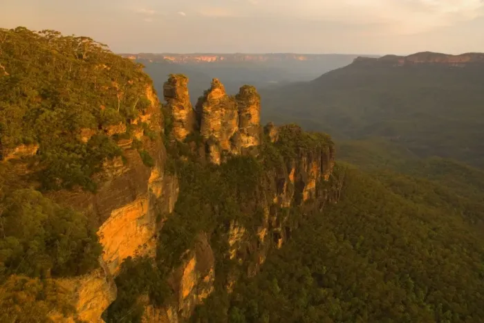 Framed Print : The Three Sisters - famous sandstone formations Three Sisters, seen from Echo Lookout, at sunset. The low sun plunges the scenery in exquisite red light - Blue Mountains National Park, New South Wales, Australia Framed Print : The Three Sisters - famous sandstone formations Three Sisters, seen from Echo Lookout, at sunset. The low sun plunges the scenery in exquisite red light - Blue Mountains National Park, New South Wales, Australia