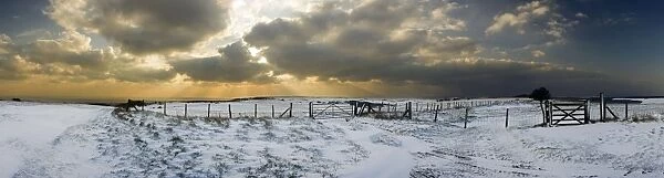 Snowy landscape under a sunburst sky - South Downs - East Sussex - United Kingdom