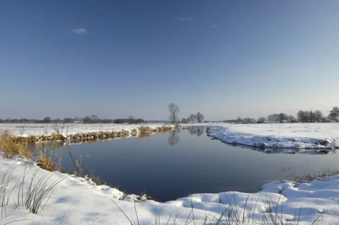 Framed Print : snowy polder landscape with brook Framed Print : snowy polder landscape with brook