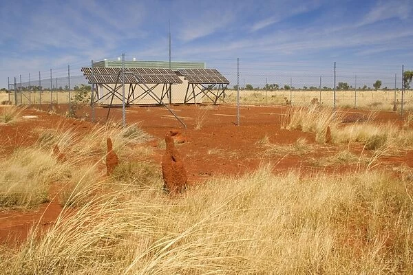 solar power station - a typical power station fed by solar panels in Australia's outback. It is located amidst dry grassland and the solar panels and transformer are fenced off for protection - Western Australia, Australia