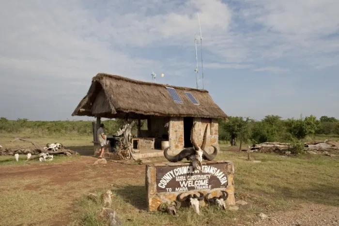 Framed Print : Solar PV Panels & Wind Turbine - on thatched roof game reserve entrance - Masai Mara - Kenya Framed Print : Solar PV Panels & Wind Turbine - on thatched roof game reserve entrance - Masai Mara - Kenya