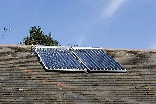 Solar thermal panels with evacuated tubes on roof of Worcestershire House provide domestic hot water UK