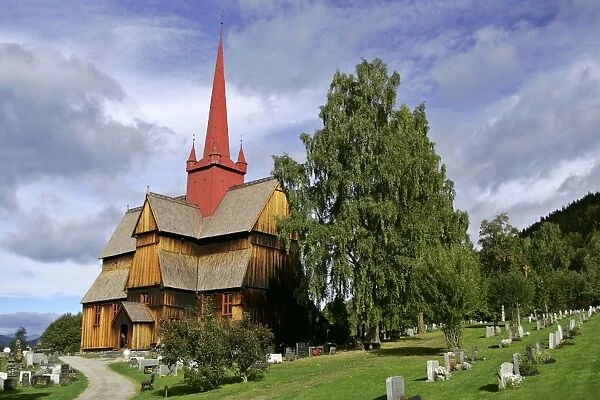 Stave church of Ringebu with cemetry in early autumn municipality of Ringebu, Gudbrandsdalen, Oppland, Norway