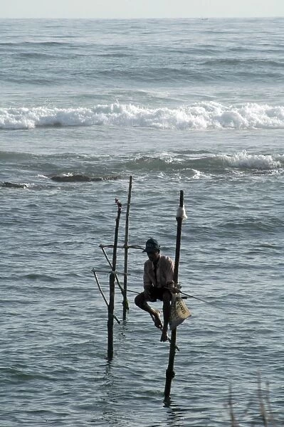 Stilt fishermen in southern Sri Lanka- perch here at auspicious states of the tide to catch or spear coastal fishes