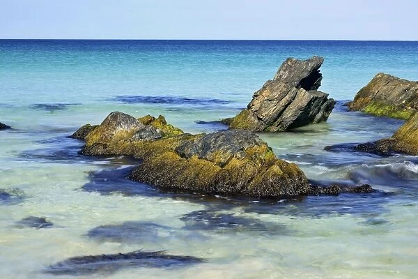 Summer beach blue sea and rocks at beach of Scousburgh Sands South Mainland, Shetland Isles, Scotland, UK