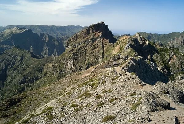 The Summit - Pico do Arieiro. At a height of 1818 m. this is the third highest peak in Madeiro. The predominant colours of purple, burnt orange and chocolate brown are a reminder of the Island's volcanic origins. February