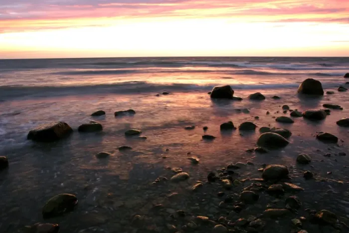 Framed Print : Sunrise at sea beach with boulders and approaching waves Moen Peninsula, Denmark Framed Print : Sunrise at sea beach with boulders and approaching waves Moen Peninsula, Denmark