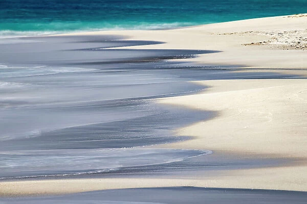 Surf pattern washing up on white sandy beach, Espanola Island, Galapagos Islands, Ecuador. Date: 30-07-2021