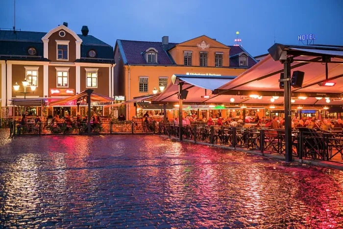 Framed Print : Sweden, Linkoping, cafes and bars on Stora target square, dusk Date: 18-05-2019 Framed Print : Sweden, Linkoping, cafes and bars on Stora target square, dusk Date: 18-05-2019