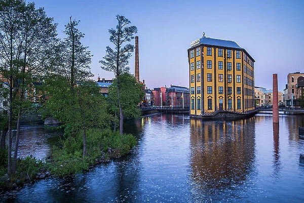 Sweden, Norrkoping, early Swedish industrial town, Arbetets Museum, Museum of Work in former early 20th century mill building, dusk Date: 16-05-2019