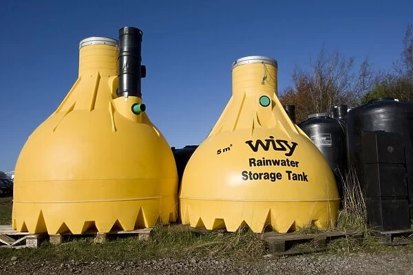 Tanks - Large yellow plastic Wisy rainwater storage tank. Green Shop Bisley UK