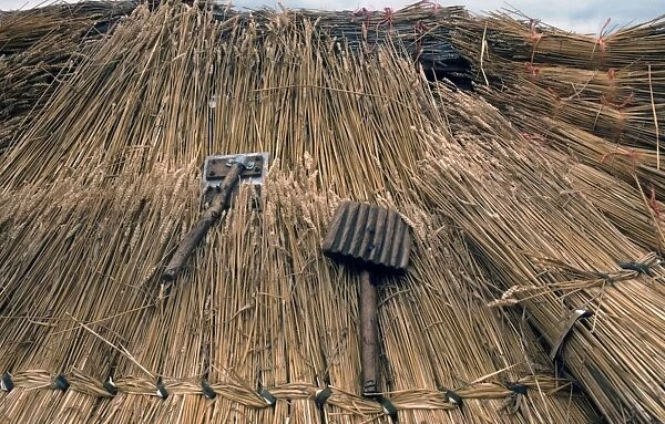 Thatcher's tools- with straw thatching
