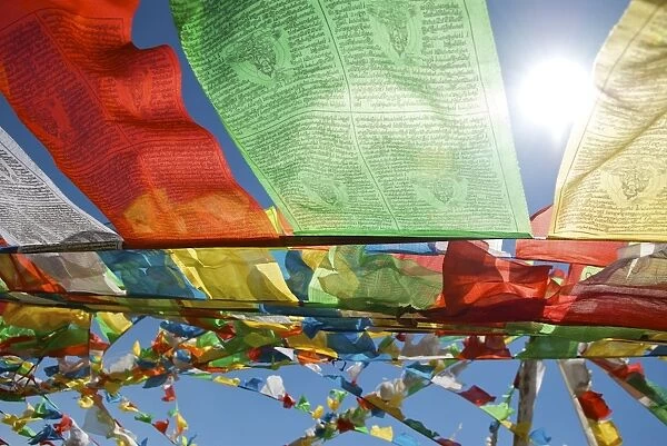 Tibet prayer flags against the sun