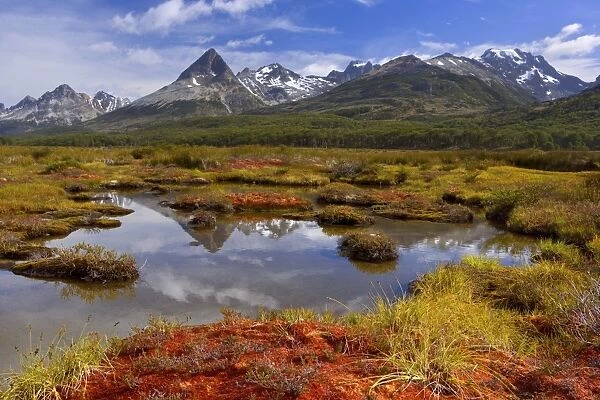 Tierra del Fuego - mountain range reflects in a