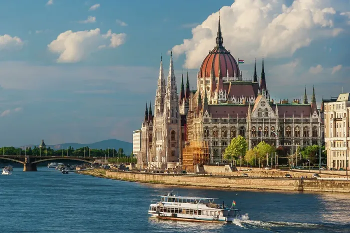 Framed Print : Tour boat passes Hungary's Parliament, built between 1884-1902 is the country's largest building. It has 691 rooms and sits next to the Danube River, Budapest, Hungary. Date: 27-06-2007