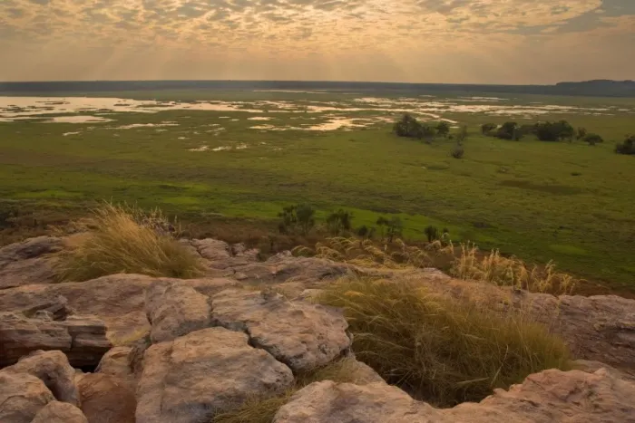 Framed Print : Ubirr view - breathtaking view from Ubirr rock towards the Nardab floodplain. The evening sun is partly hidden behind beautiful clouds and sends sunrays through the open gaps between the clouds Framed Print : Ubirr view - breathtaking view from Ubirr rock towards the Nardab floodplain. The evening sun is partly hidden behind beautiful clouds and sends sunrays through the open gaps between the clouds