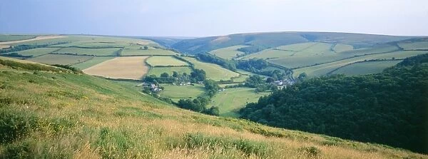 UK - high summer landscape, bleached grasses & patchwork fields. Nr. Exford, North Devon