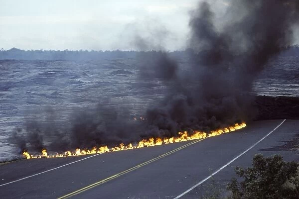 USA - Hawaii - Big Island - Eruption of the Pu'u O'o Vent - a vent of the Kilauea Volcano - Lava flow has cut the highway on the south side of the island - small flames