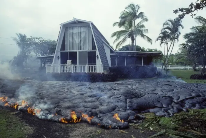Framed Print : USA - Hawaii - Big Island - Eruption of the Pu'u O'o Vent - a vent of the Kilauea Volcano - Advancing lava flow surrounds a house in the village of Kalapana Gardens on the south shore of the island Framed Print : USA - Hawaii - Big Island - Eruption of the Pu'u O'o Vent - a vent of the Kilauea Volcano - Advancing lava flow surrounds a house in the village of Kalapana Gardens on the south shore of the island