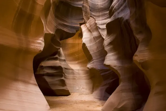 Framed Print : USA - Light that penetrates into the narrow canyon walls creates beautiful hues on the graceful curves of sandstone rock in the Upper Antelope Canyon, probably the most famous slot canyon in the Southwest. Antelope Canyon
